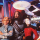 In-character cast-members posing in front of the Experience’s main entrance.